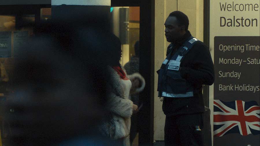 Terence the security guard outside the shops in a scene from this short film