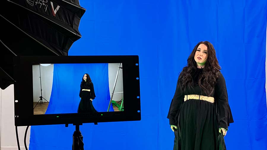 The Wookey Hole Witch against a blue screen backdrop